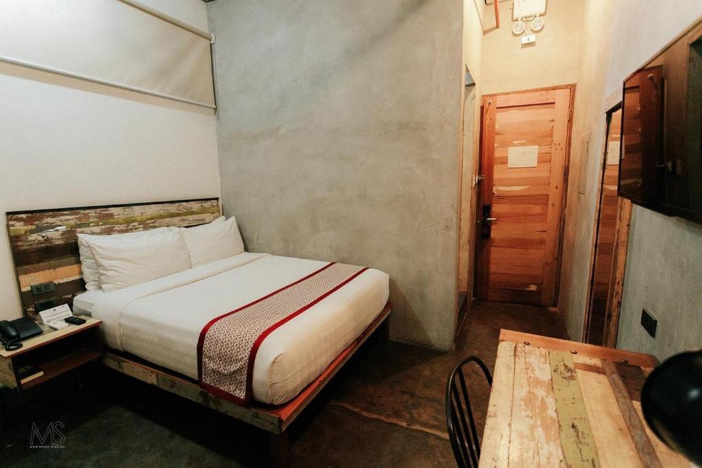 Postel nebo postele na pokoji v ubytování The Bricks Hotel