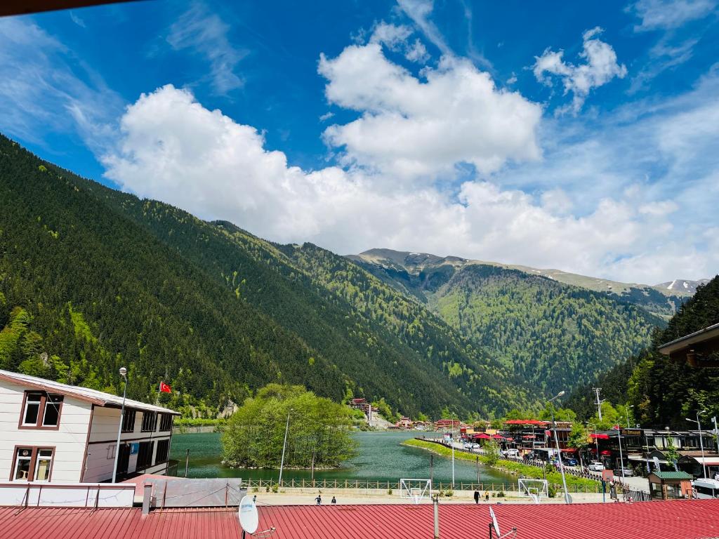 a view of a river with mountains in the background at Desera Pansiyon in Uzungöl