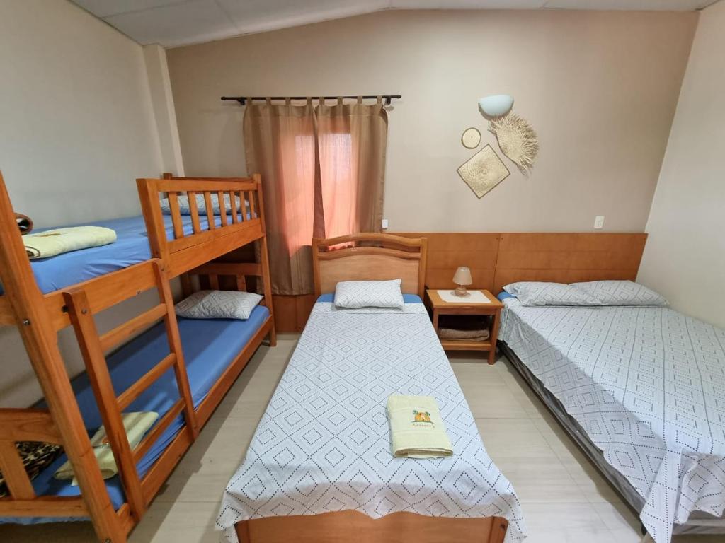 Postel nebo postele na pokoji v ubytování Hotel Karanda´y