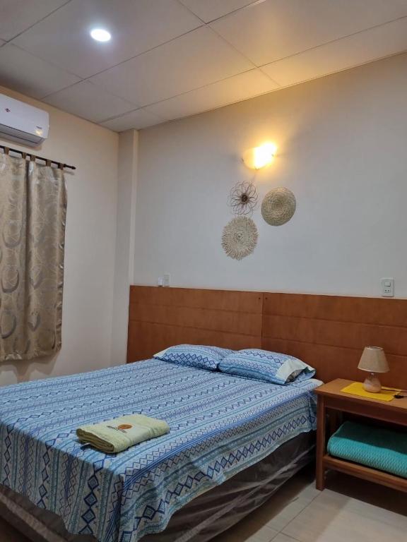 Postel nebo postele na pokoji v ubytování Hotel Karanda´y