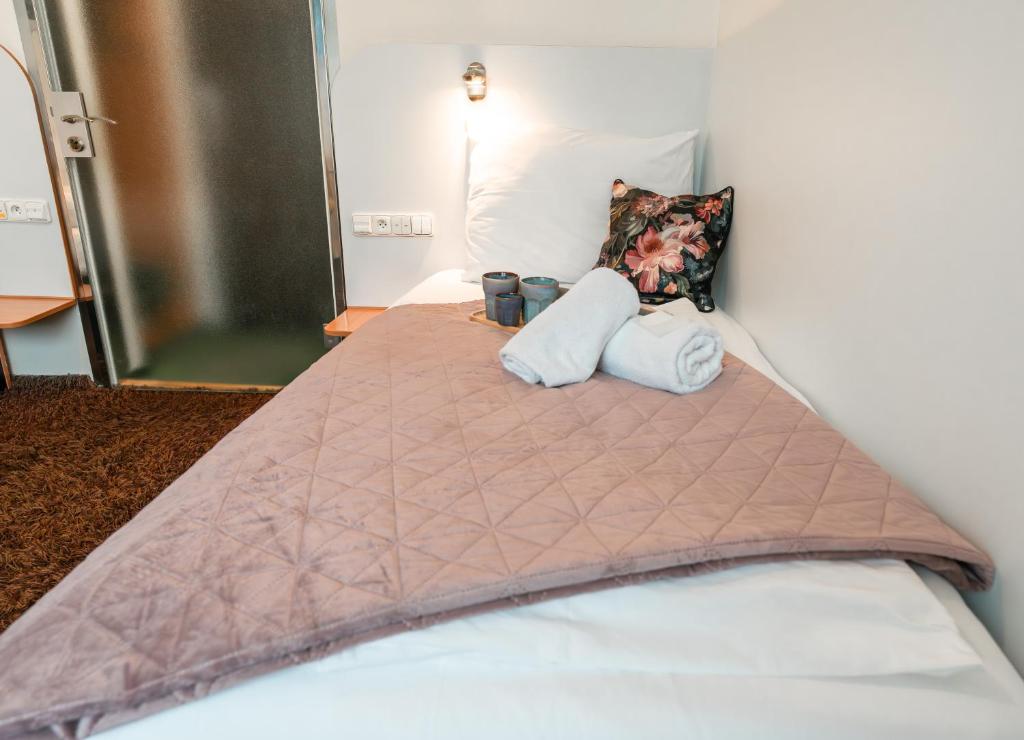 Postel nebo postele na pokoji v ubytování Hotel Plzeň