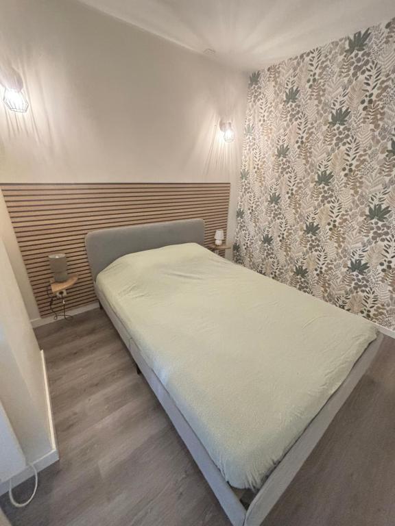 Postel nebo postele na pokoji v ubytování JC Appart