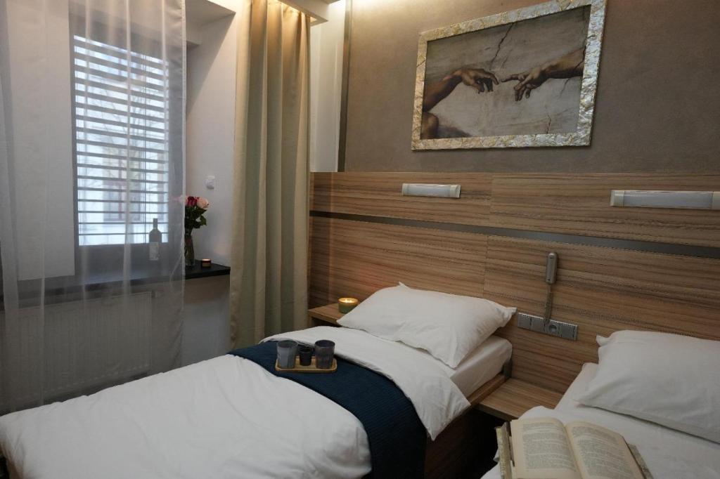 Postel nebo postele na pokoji v ubytování Hotel Plzeň