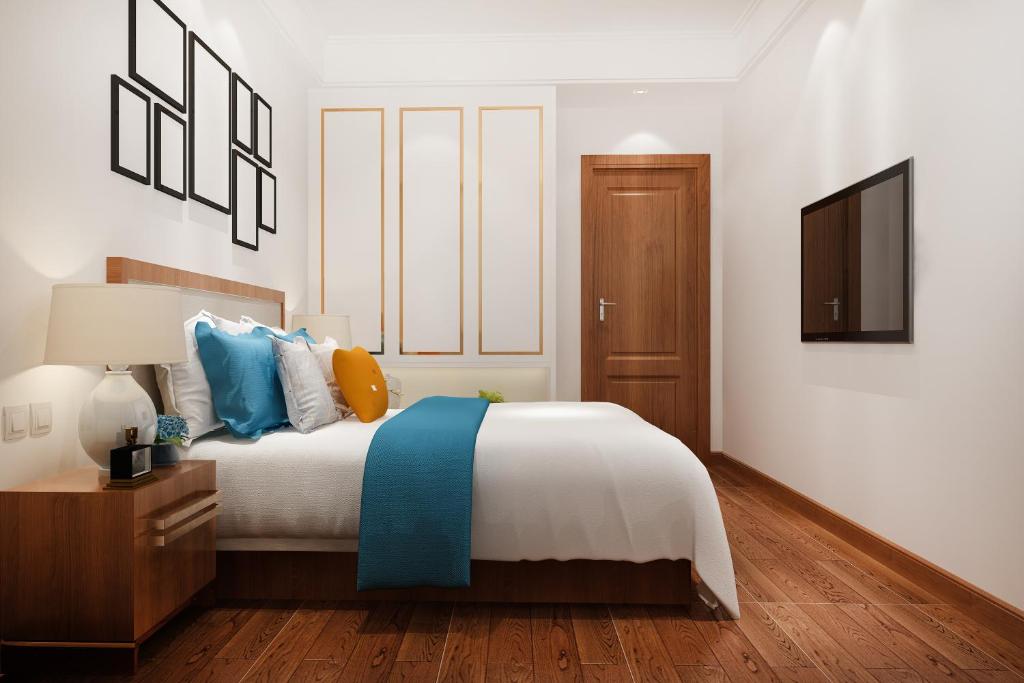 Postel nebo postele na pokoji v ubytování Hotel Palm Emarald