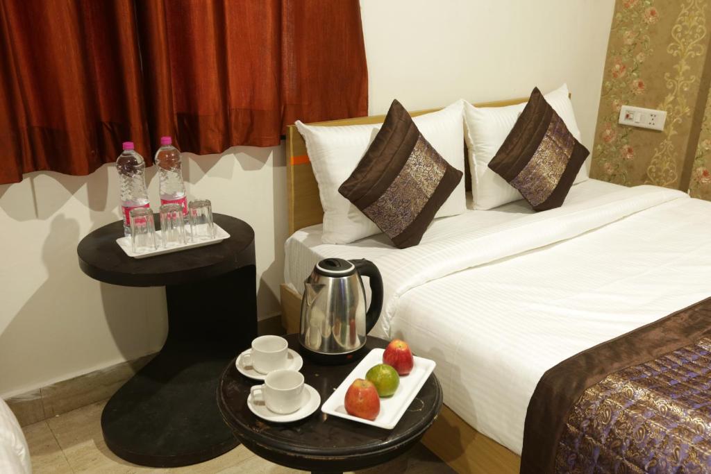 Postel nebo postele na pokoji v ubytování Hotel Palm Emarald