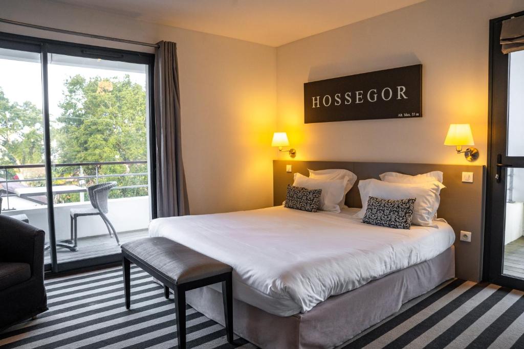 Postel nebo postele na pokoji v ubytování Hotel 202