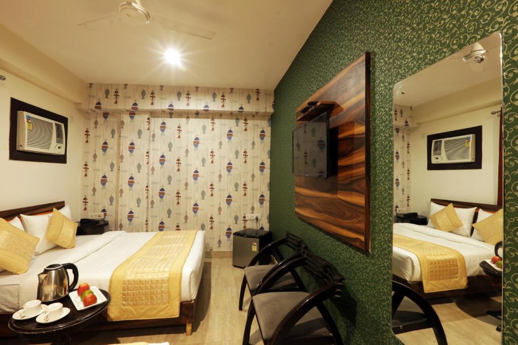 Postel nebo postele na pokoji v ubytování Hotel Palm Emarald