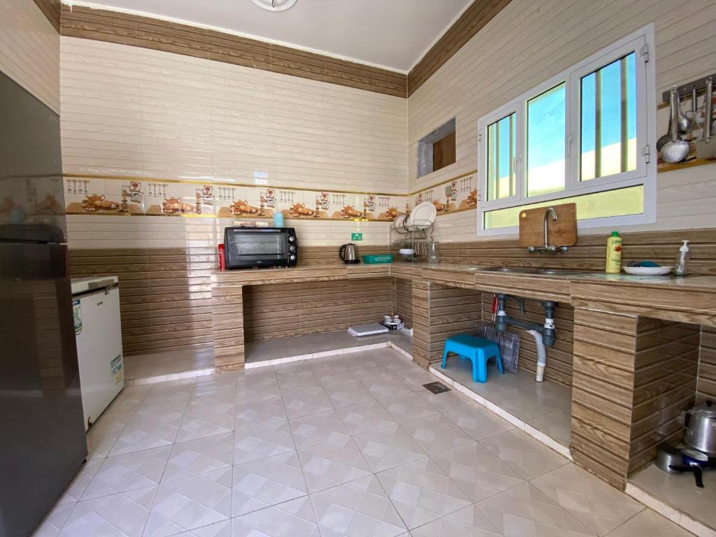 Kuchyň nebo kuchyňský kout v ubytování Villa 94 Ras Al Hadd