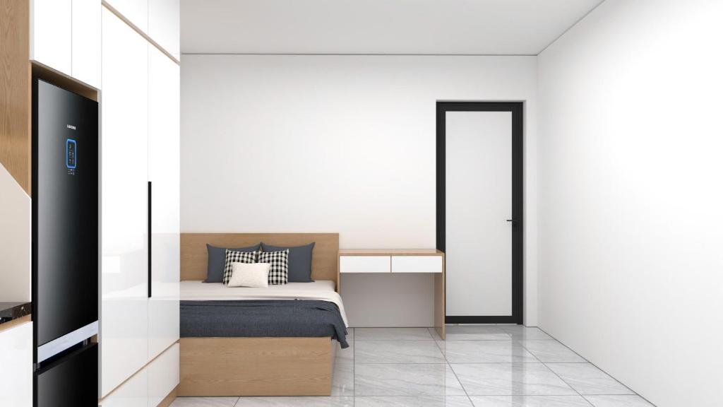 Postel nebo postele na pokoji v ubytování Ami Home Đội Cấn