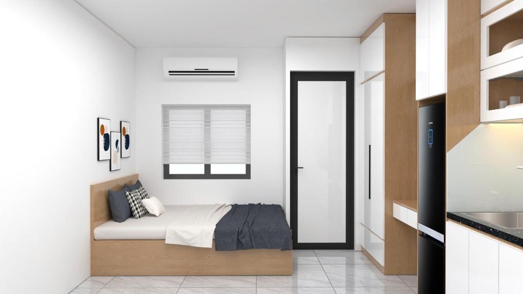 Postel nebo postele na pokoji v ubytování Ami Home Đội Cấn