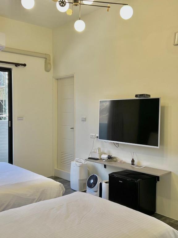 Postel nebo postele na pokoji v ubytování Kaile Roaming Homestay