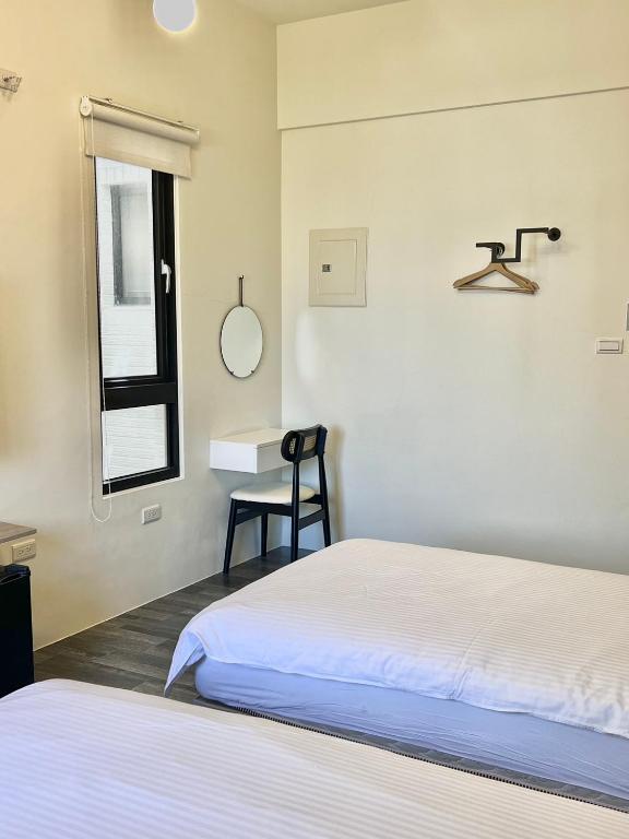 Postel nebo postele na pokoji v ubytování Kaile Roaming Homestay