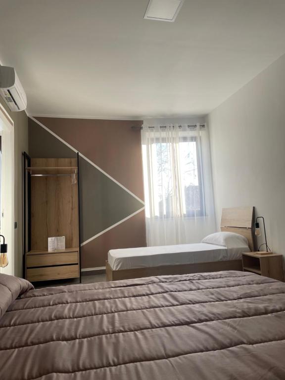 Postel nebo postele na pokoji v ubytování Hotel Riesco