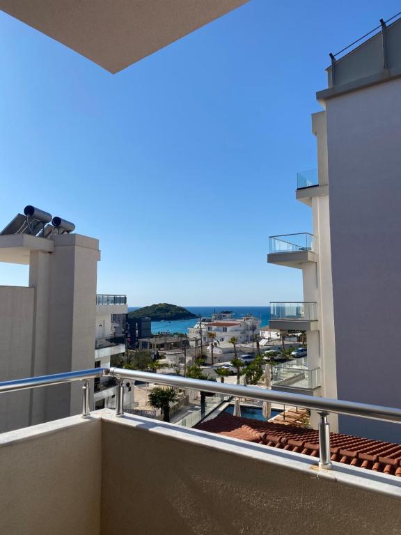a balcony with a view of the ocean at Hotel Marku in Ksamil