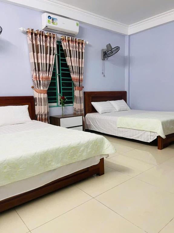 Postel nebo postele na pokoji v ubytování Nhà nghỉ Thường Nga