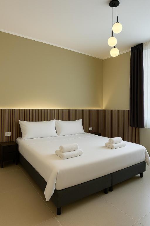 Postel nebo postele na pokoji v ubytování Maison ì room & suites