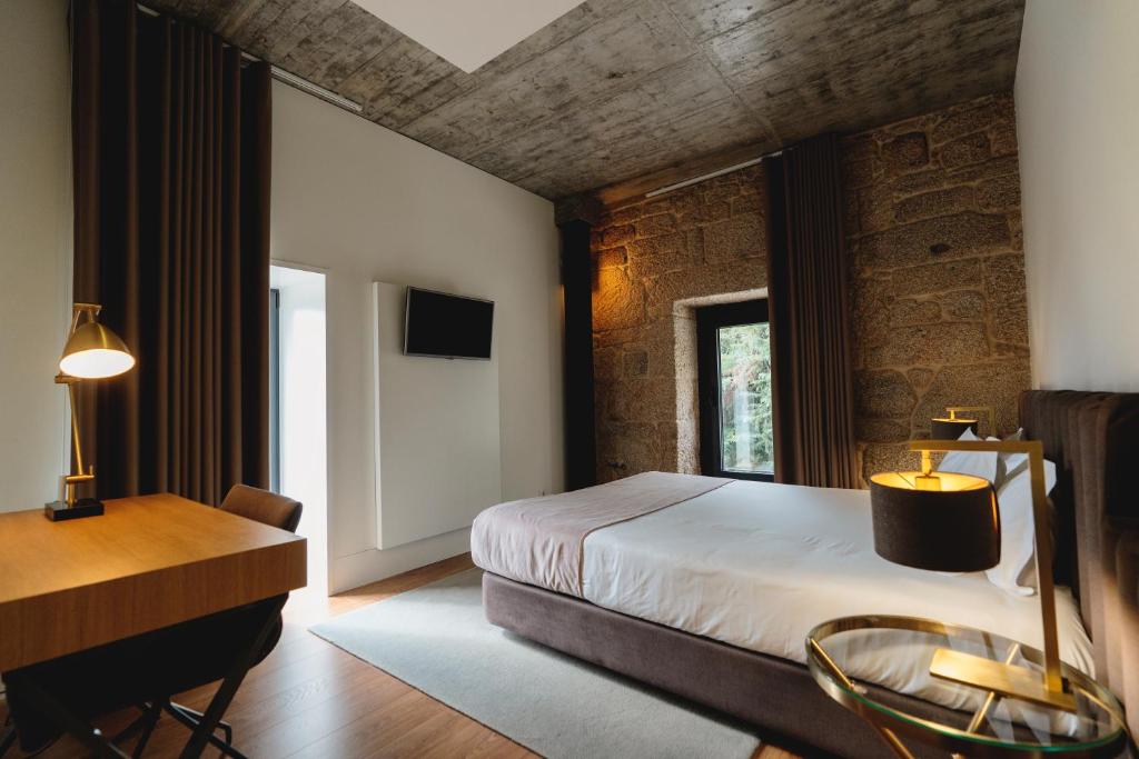 Ένα ή περισσότερα κρεβάτια σε δωμάτιο στο Borralha Hotel, Restaurante & Spa