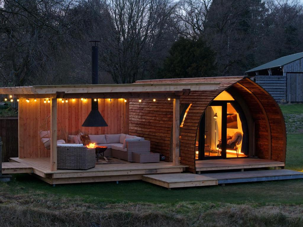 a small wooden house with a living room in a yard at Montrave Estate by Wigwam Holidays in Pitlessie
