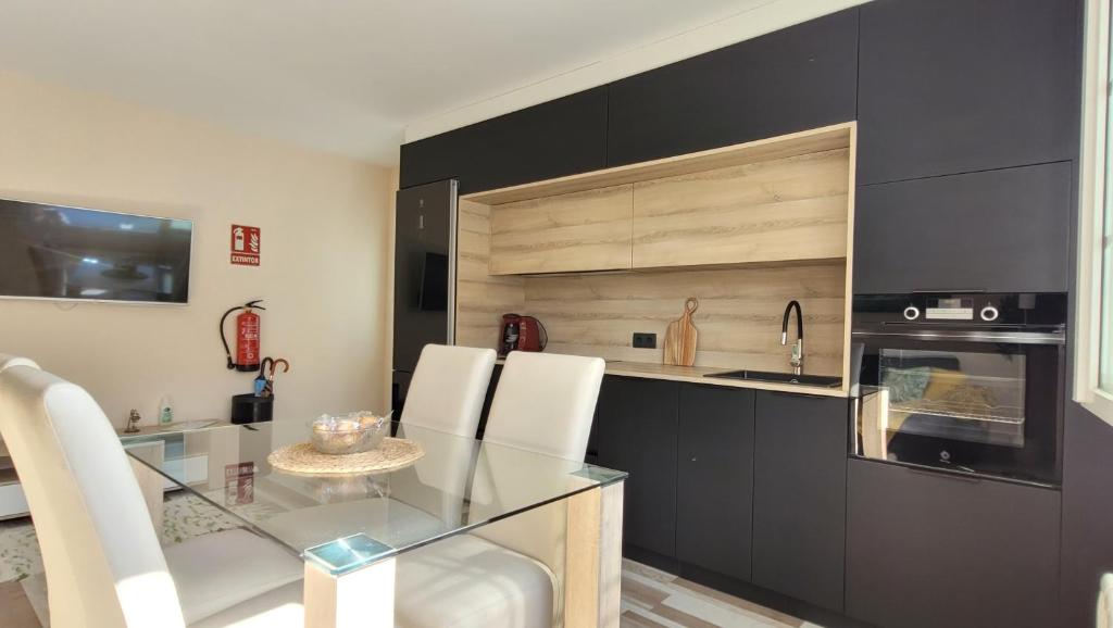 Kuchyň nebo kuchyňský kout v ubytování Besbello Suites Apartamento