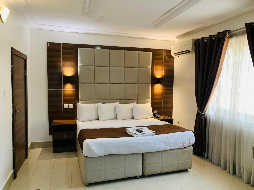 Postel nebo postele na pokoji v ubytování Presken Hotels @ Freedom Way, Lekki