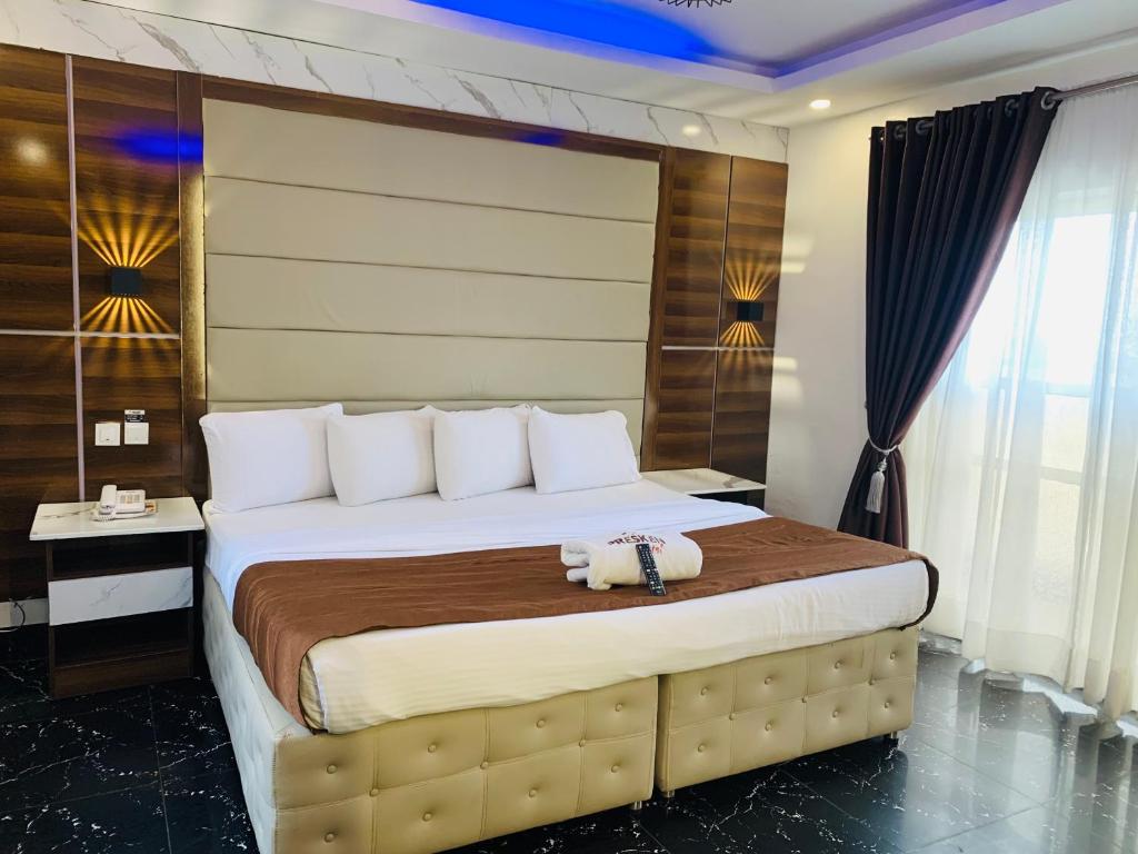 Postel nebo postele na pokoji v ubytování Presken Hotels @ Freedom Way, Lekki