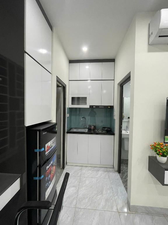 Kuchyň nebo kuchyňský kout v ubytování Ami Home Đội Cấn