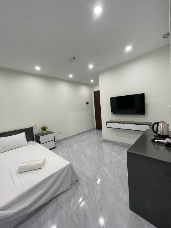 TV a/nebo společenská místnost v ubytování Ami Home Đội Cấn