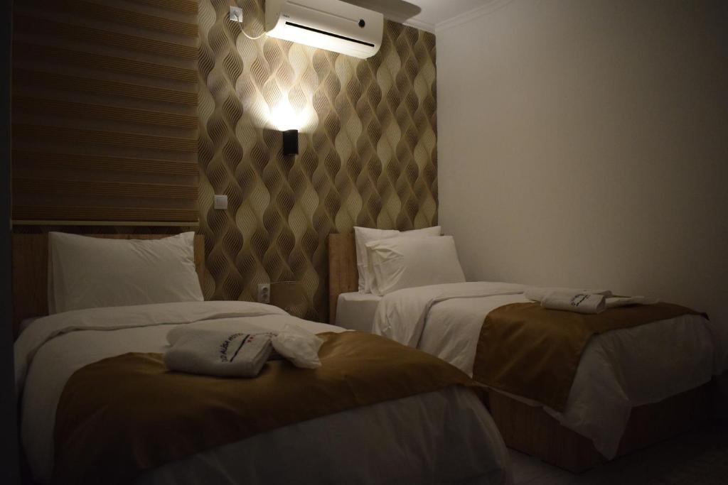 Postel nebo postele na pokoji v ubytování Hotel Alisa