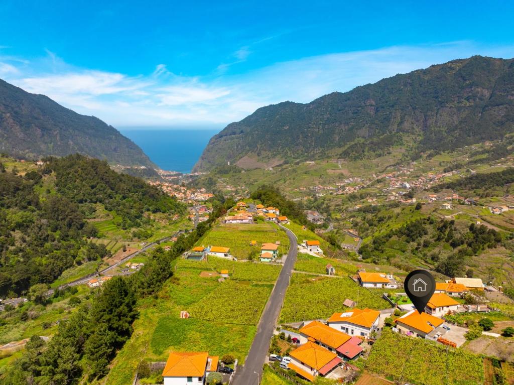 an aerial view of a village in the mountains at Casa Vale da Laurissilva in São Vicente
