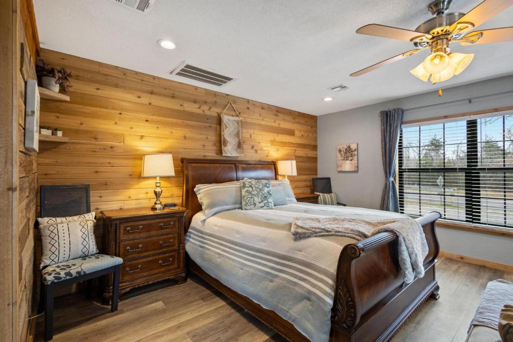 a bedroom with a bed and a ceiling fan at Cozy Hideaway in Denison Tx in Denison