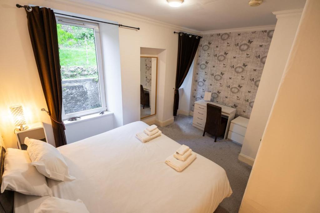 Postel nebo postele na pokoji v ubytování Oban Hideaway