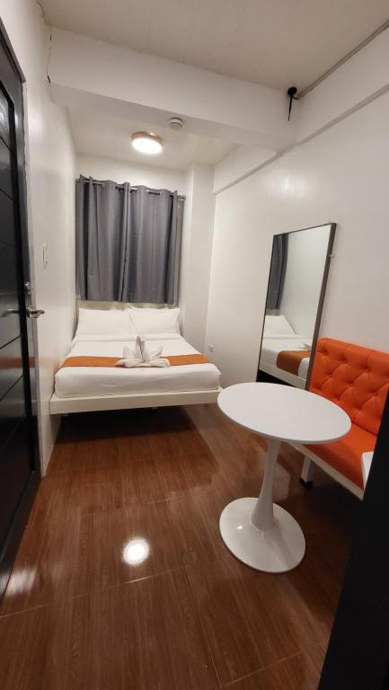 Postel nebo postele na pokoji v ubytování Rangya Hotel