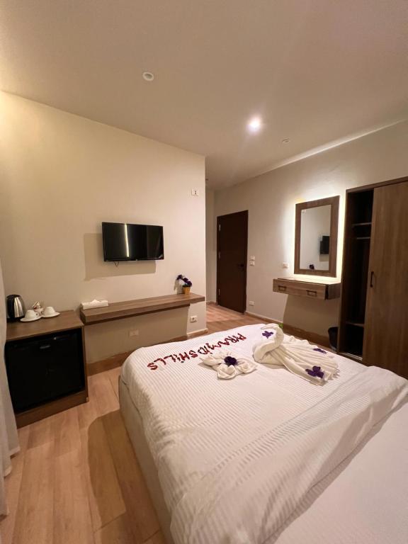 TV a/nebo společenská místnost v ubytování Amigo Pyramids Hotel