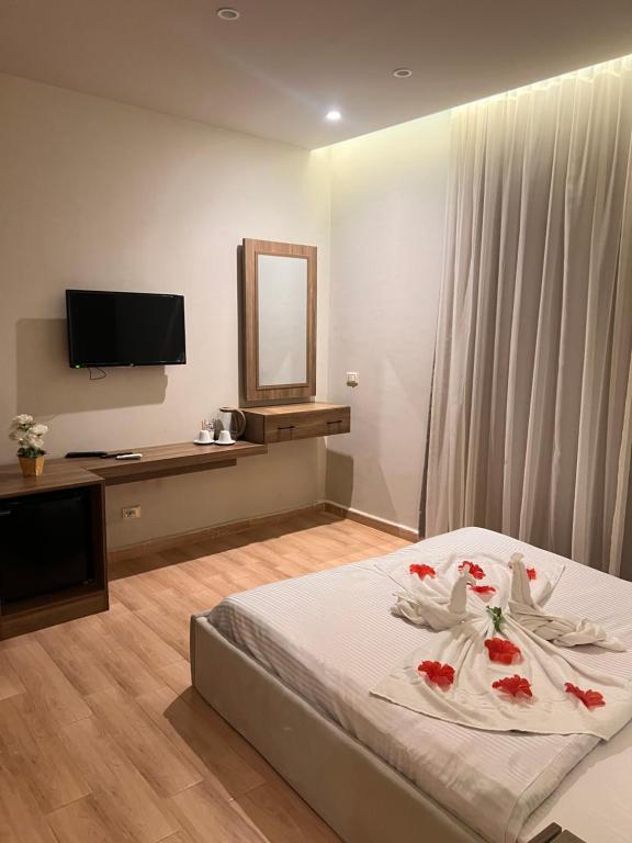 Postel nebo postele na pokoji v ubytování Amigo Pyramids Hotel
