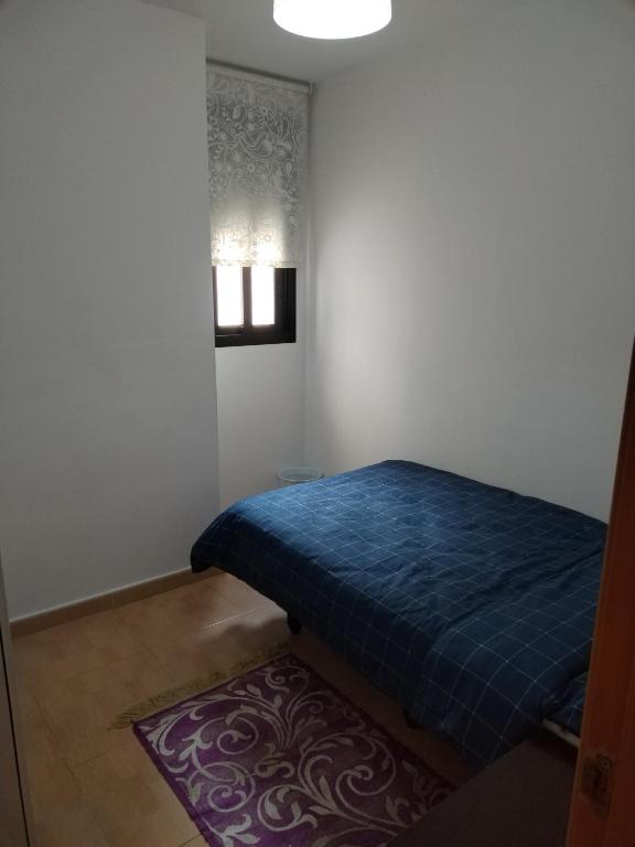 Postel nebo postele na pokoji v ubytování Habitación Ático Sol y Mar