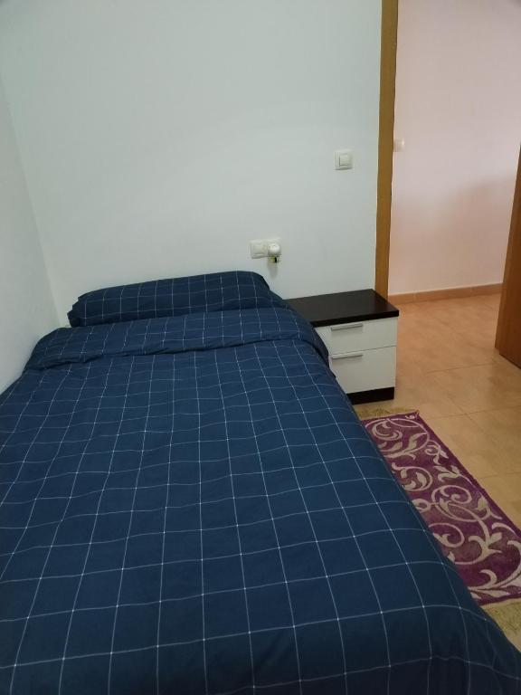 Postel nebo postele na pokoji v ubytování Habitación Ático Sol y Mar