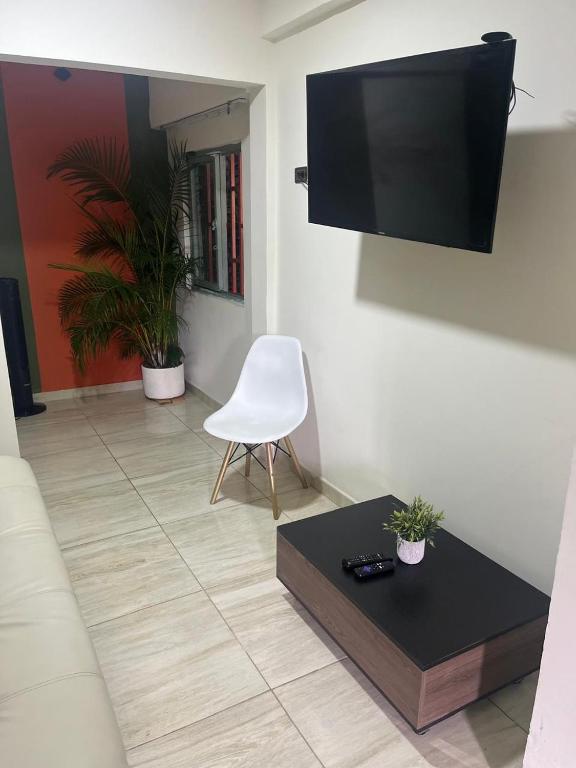 TV a/nebo společenská místnost v ubytování Alojamiento Frente al Parque del Café