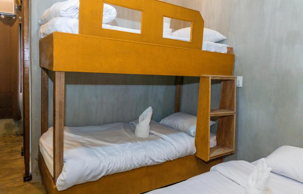 Postel nebo postele na pokoji v ubytování Ohayo Siargao
