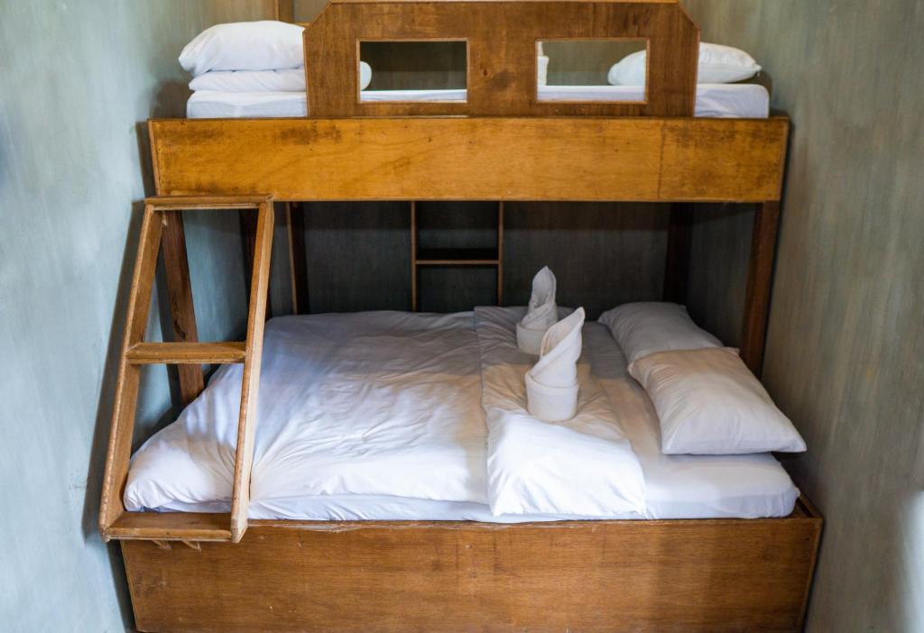 Postel nebo postele na pokoji v ubytování Ohayo Siargao