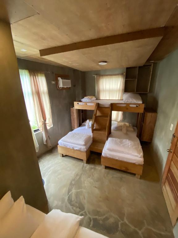 Postel nebo postele na pokoji v ubytování Ohayo Siargao