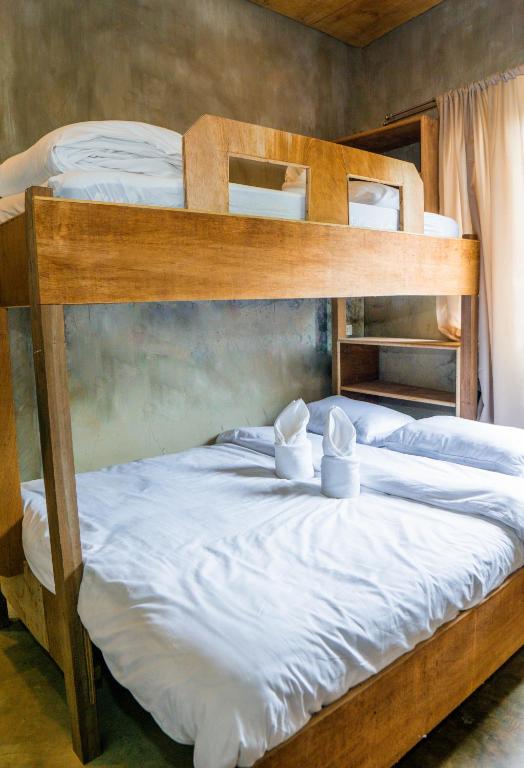 Postel nebo postele na pokoji v ubytování Ohayo Siargao