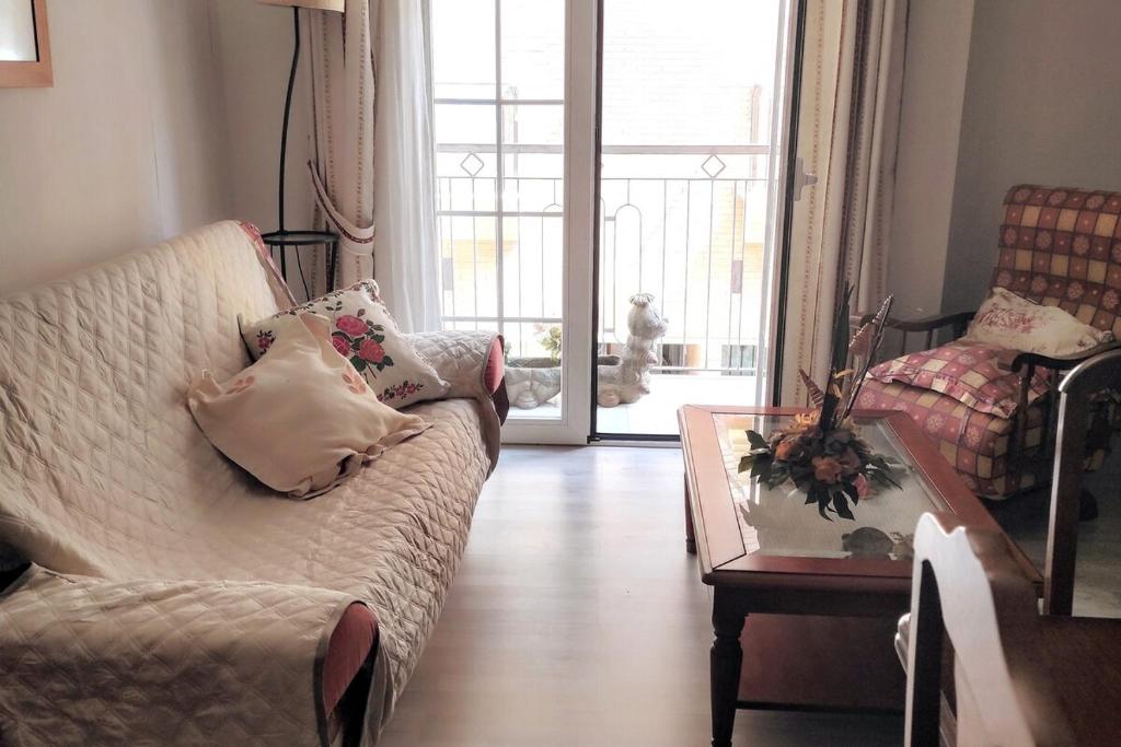 a living room with a couch and a table at Apartamento en Ejido Centro in El Ejido