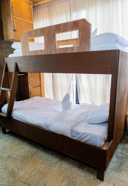 Postel nebo postele na pokoji v ubytování Ohayo Siargao