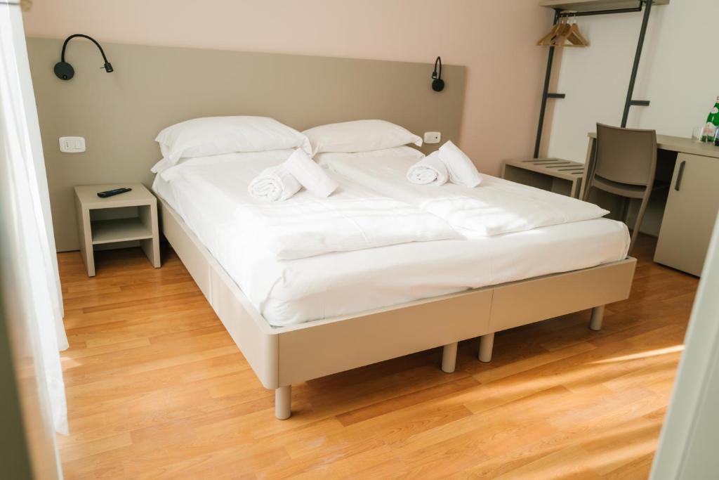 Postel nebo postele na pokoji v ubytování Ventus Park Hotel
