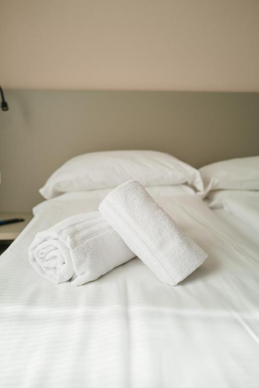 Postel nebo postele na pokoji v ubytování Ventus Park Hotel
