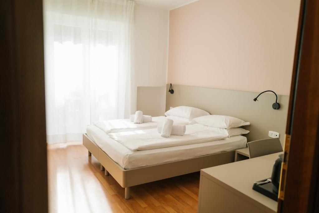 Postel nebo postele na pokoji v ubytování Ventus Park Hotel