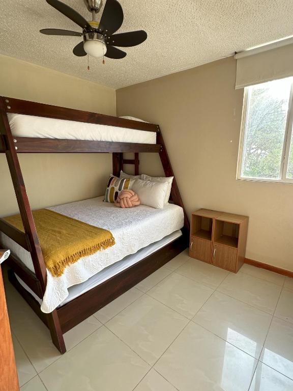 Postel nebo postele na pokoji v ubytování JV Condos Jaco