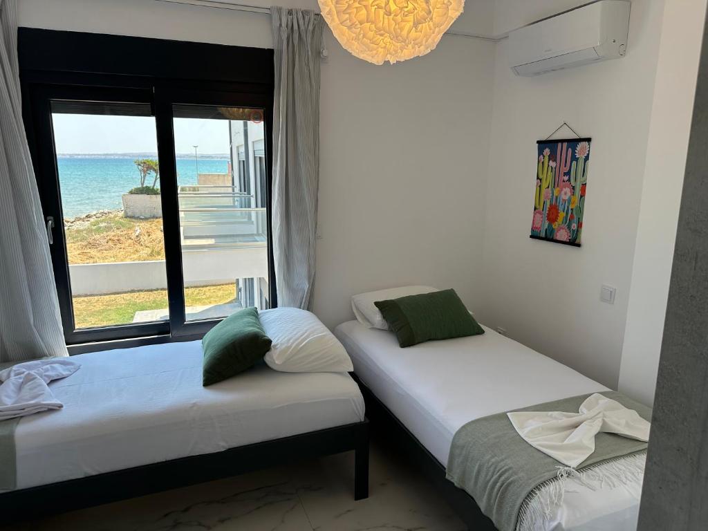 Ένα ή περισσότερα κρεβάτια σε δωμάτιο στο Villa Thea