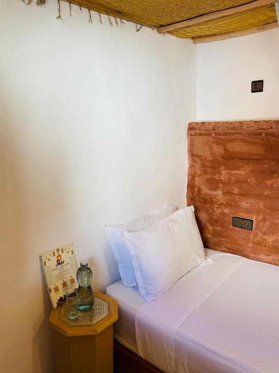Postel nebo postele na pokoji v ubytování Riad Numidia