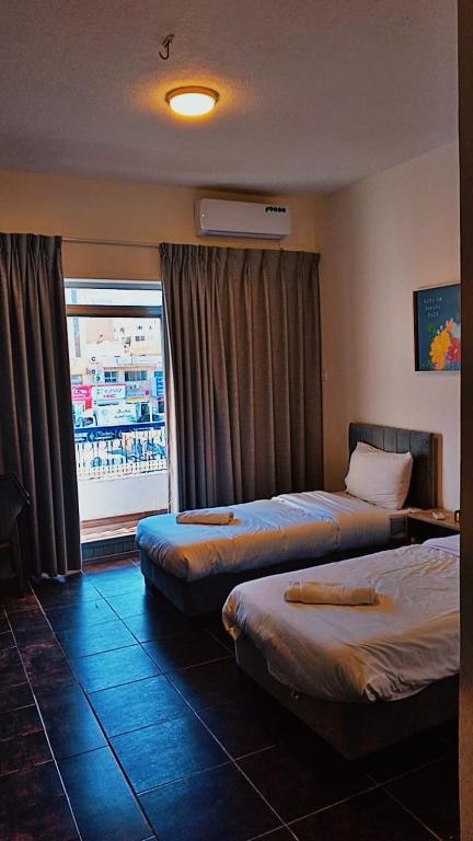 Voodi või voodid majutusasutuse Hotel magic aqaba toas